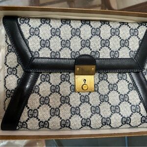 Gucci vintage blue and white clutch purse with gold clasp. 9”W X 6”H X 1/2”D